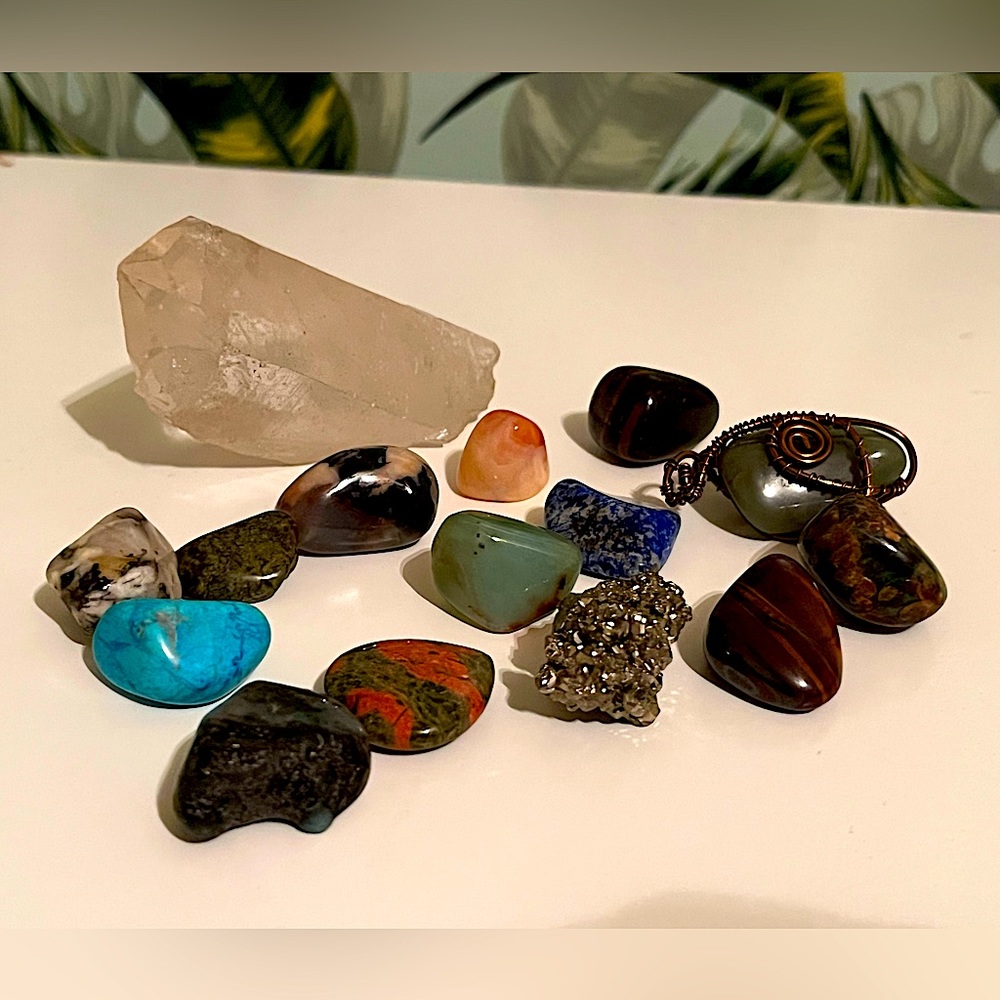 Large Clear quartz with assorted gemstones.